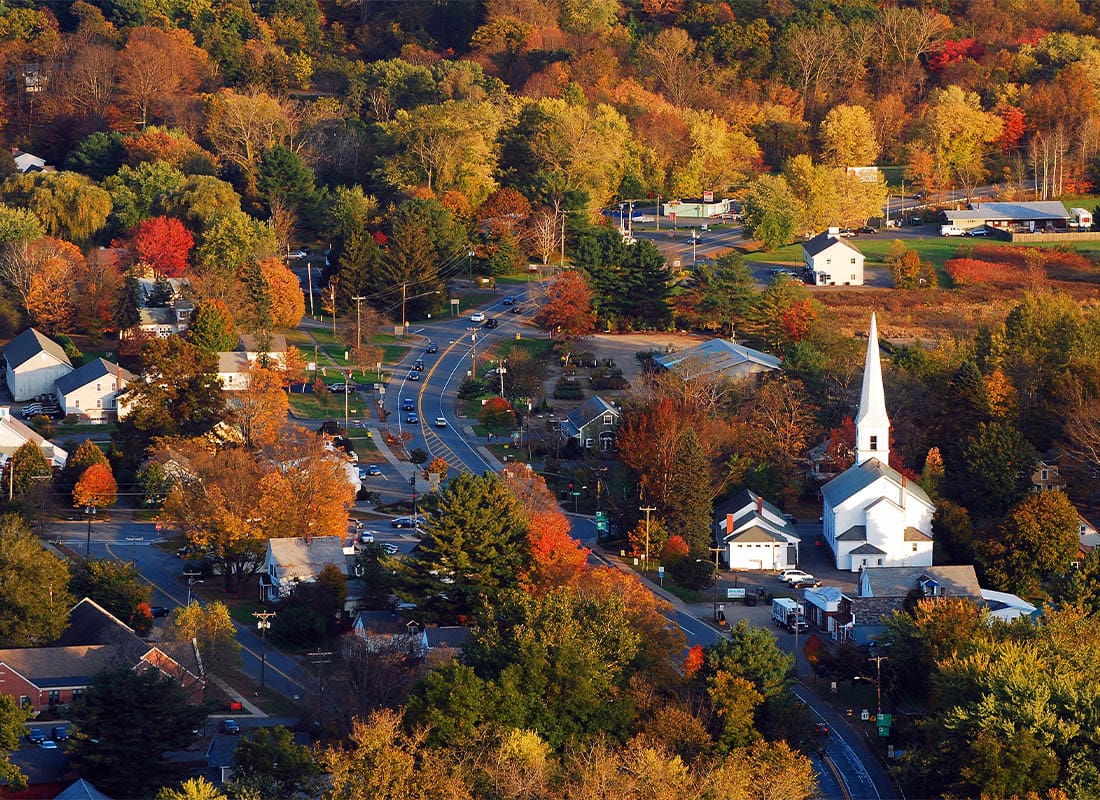 New Hampshire - a Classic New England Town, With a White Church With a Large Steeple, is Surrounded by Brilliant Autumn